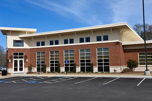 Image of commercial building with parking lot